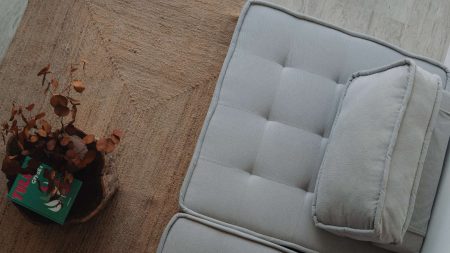 Open-concept living room in LENEVA LOFT with modern decor and large windows.